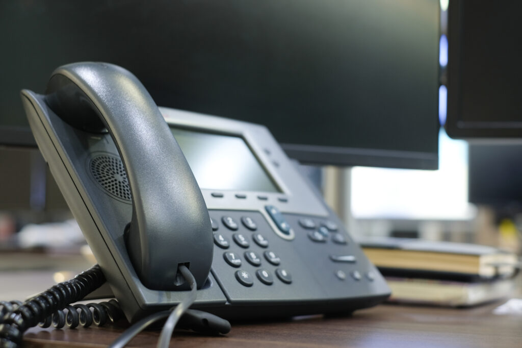 A Telephone at an Office Desk